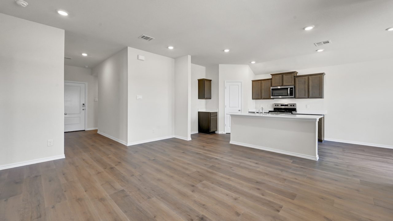 X40A open concept living area with hardwood floors