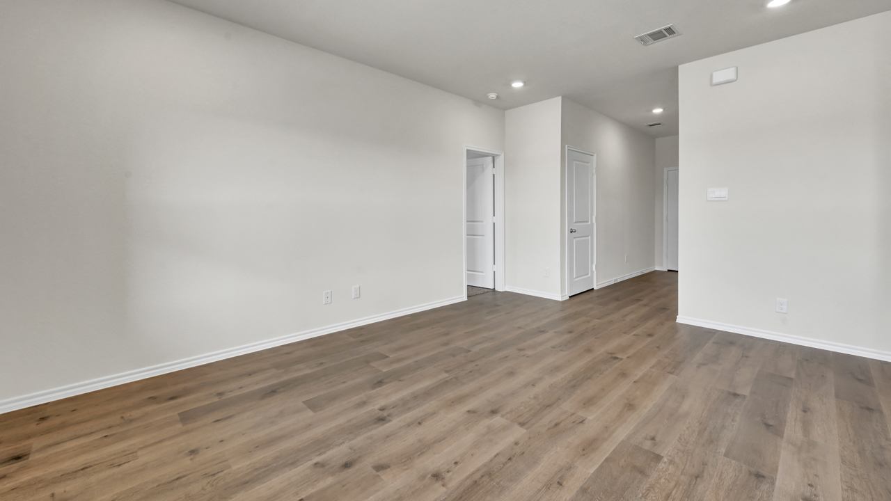 X40A living area with hardwood floors