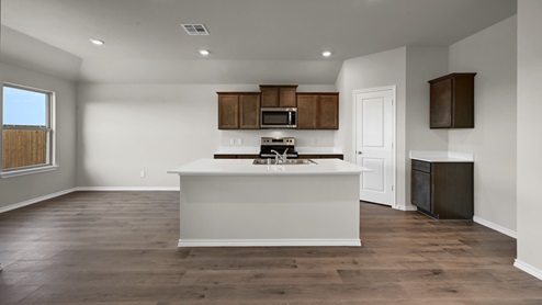 X40B kitchen with white countertops and brown cabinets