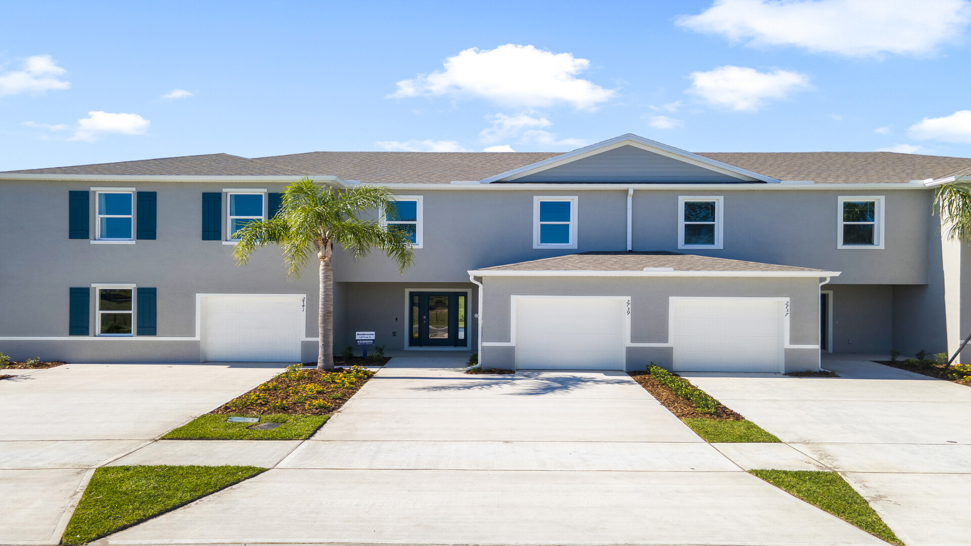Attached townhome with concrete block construction and a one-car garage.