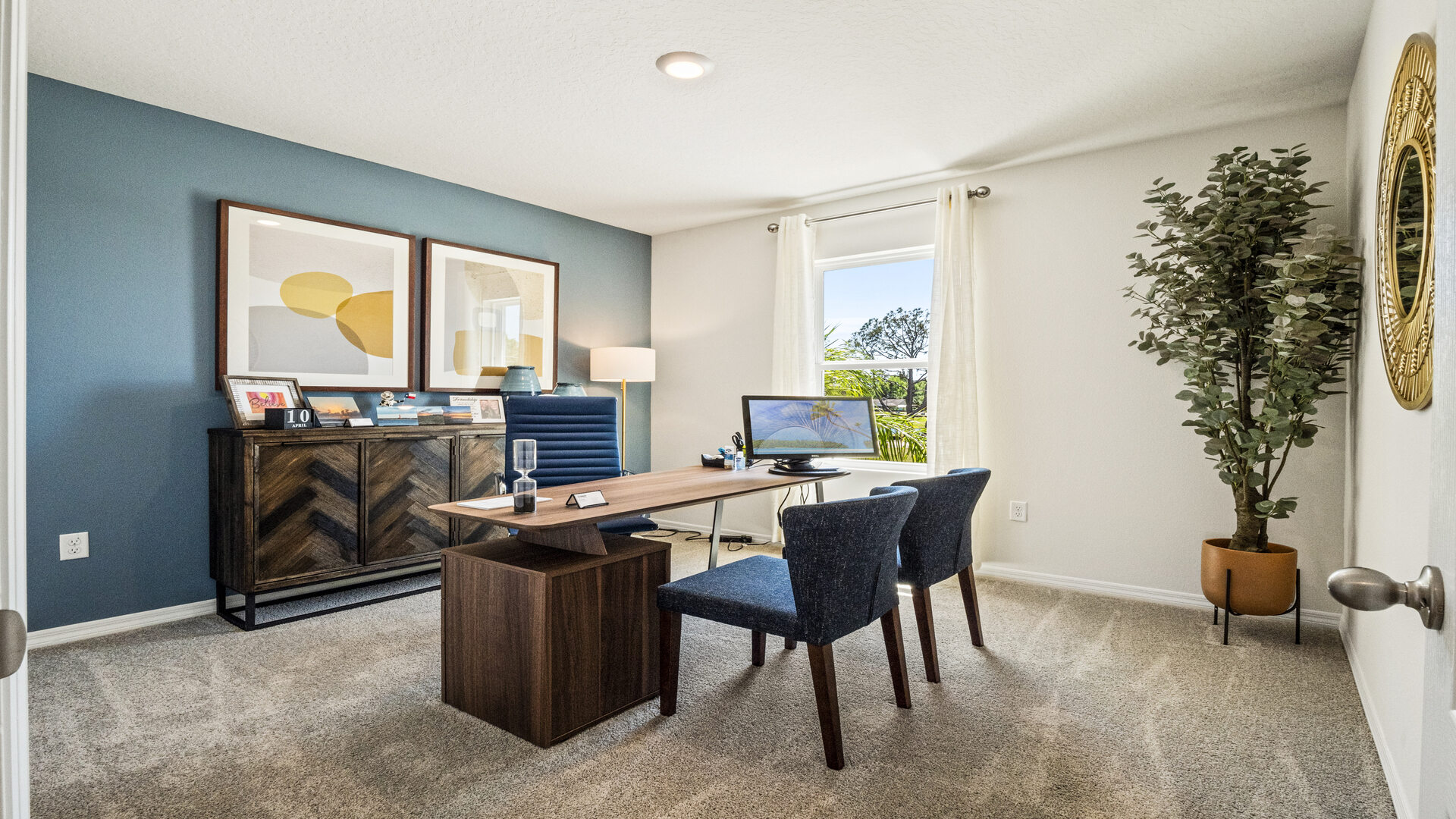 Functional home office with desk, chairs and space to work or play.