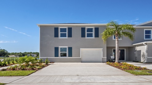 Attached townhome with concrete block construction and a one-car garage.