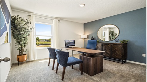 Functional home office with desk, chairs and space to work or play.