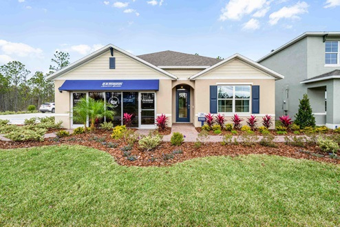 Single story new home with siding, covered porch and 2 car garage.