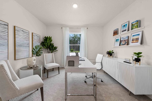 Functional home office with desk, chairs and space to work or play.