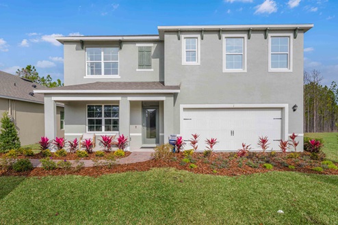 Two-story new home with siding, covered porch and 2 car garage.