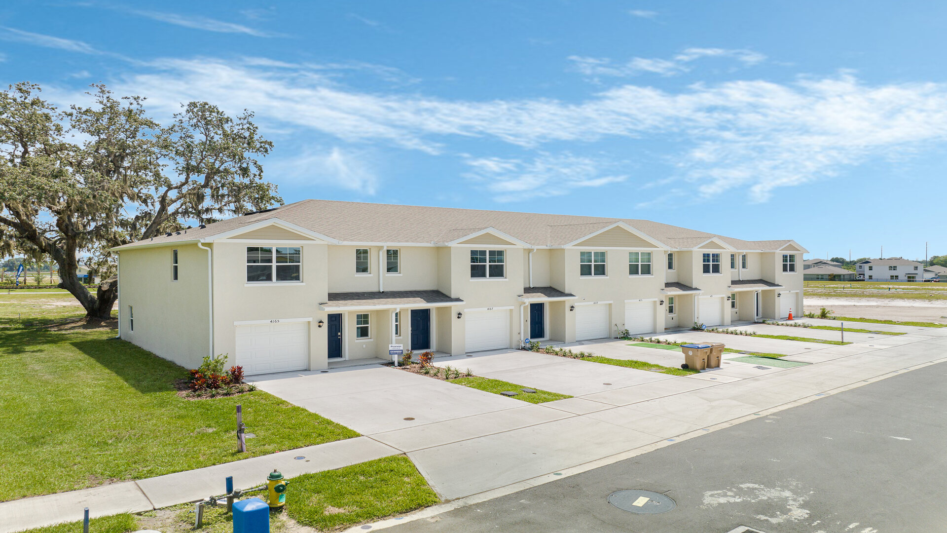 Attached townhome with concrete block construction and a one-car garage.