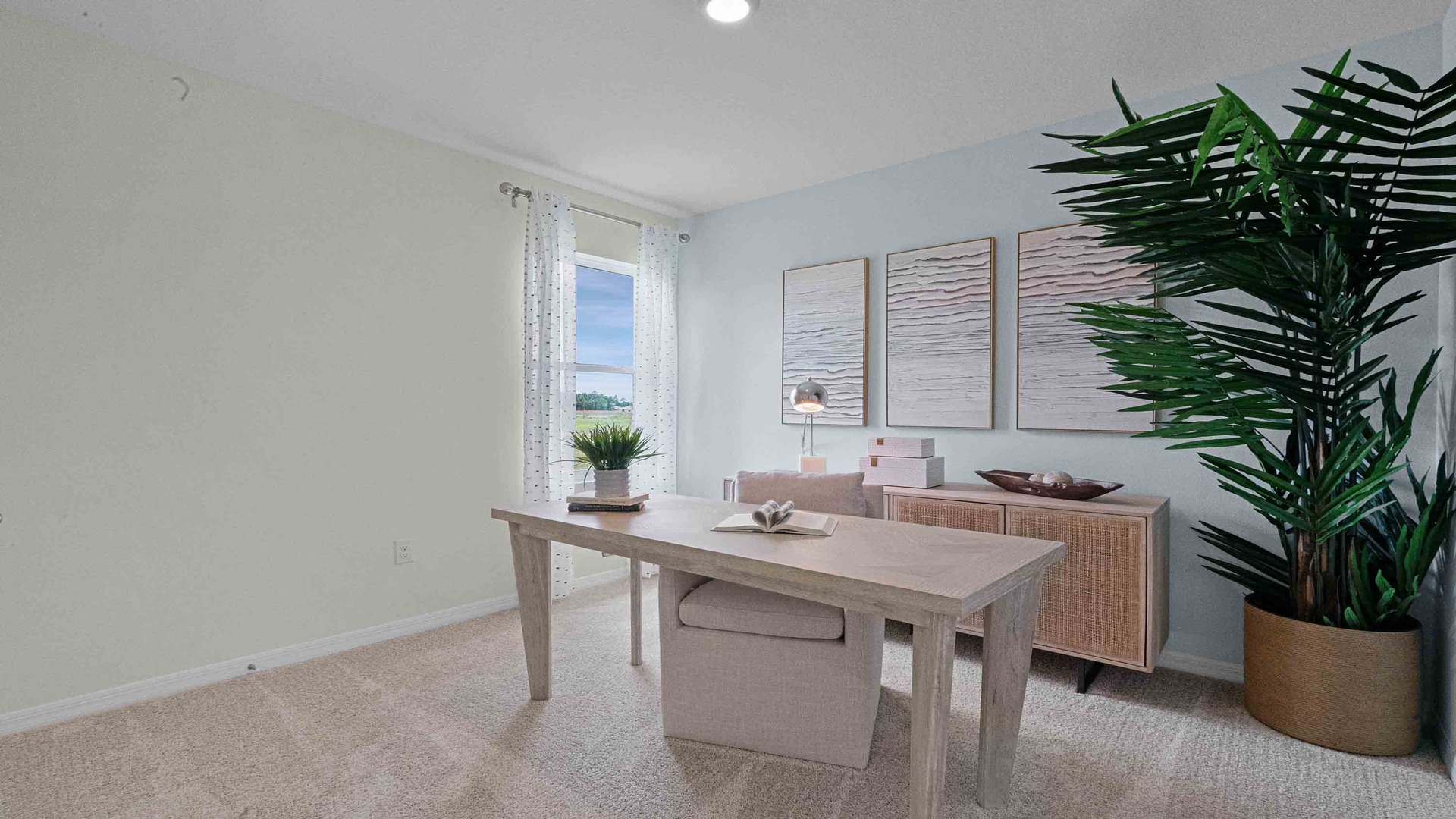 Functional home office with desk, chairs and space to work or play.