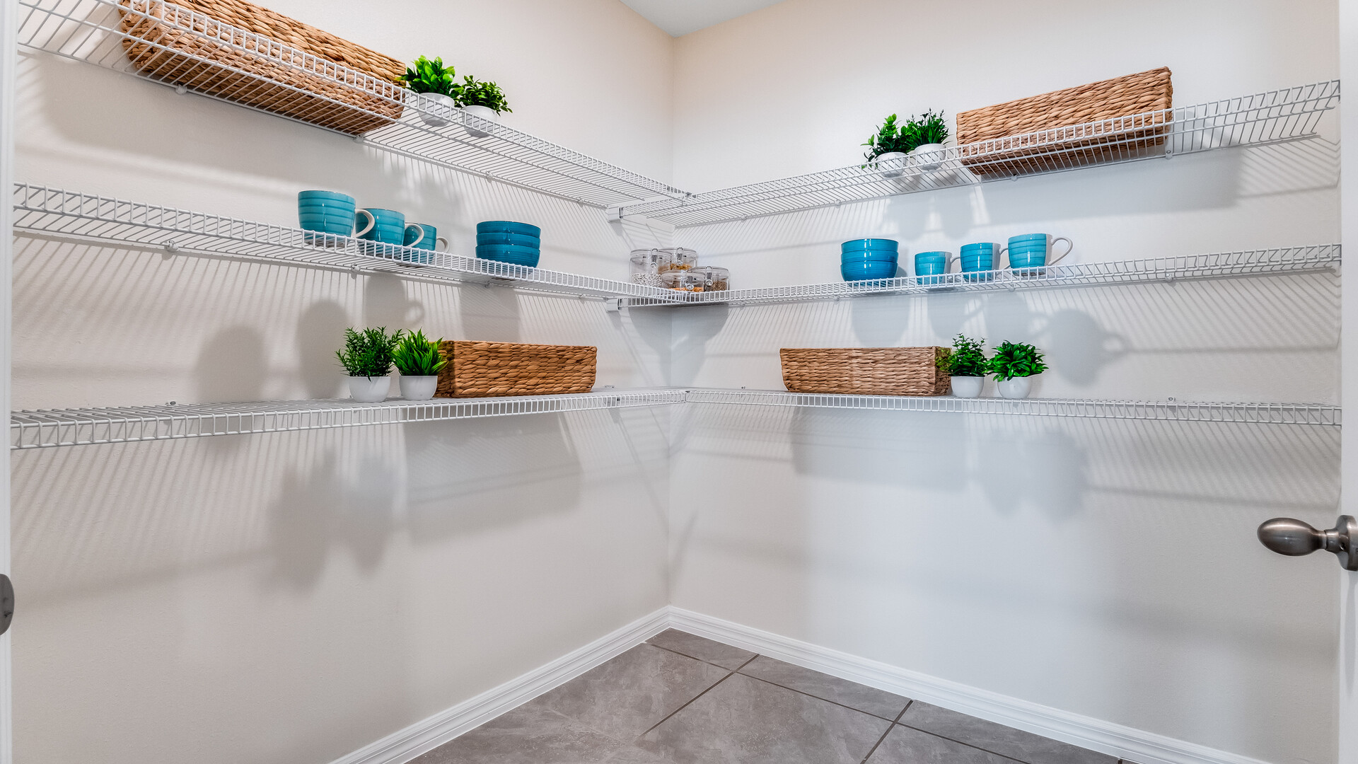 Spacious walk in closet with abundant shelving and storage.