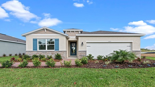 Single story new home with siding, covered porch and 2 car garage.
