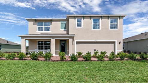 Two-story new home with siding, covered porch and 2 car garage.