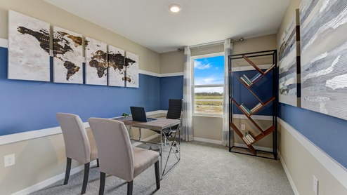 Functional home office with desk, chairs and space to work or play.