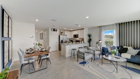 Spacious living room and kitchen. Ample room to fit a large couch and chairs.