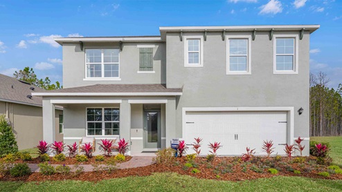 Two-story new home with siding, covered porch and 2 car garage.