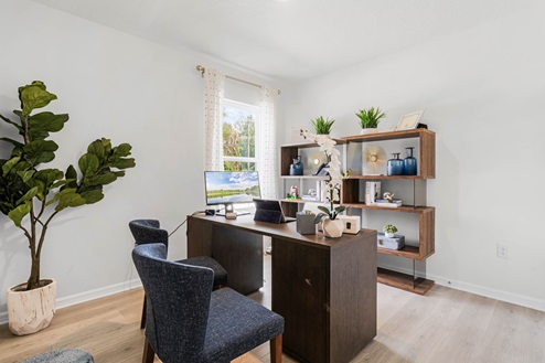 Functional home office with desk, chairs and space to work or play.