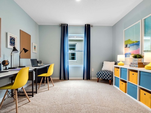 Functional home office with desk, chairs and space to work or play.