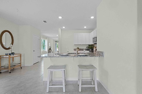 Kitchen with view overlooking living area