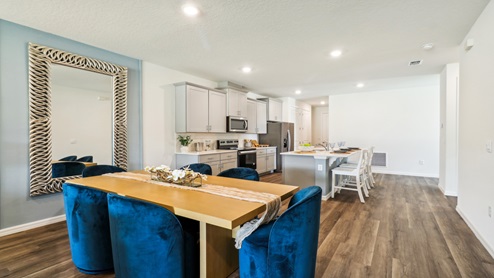 Dining room overlooking the living area, with table and chairs.
