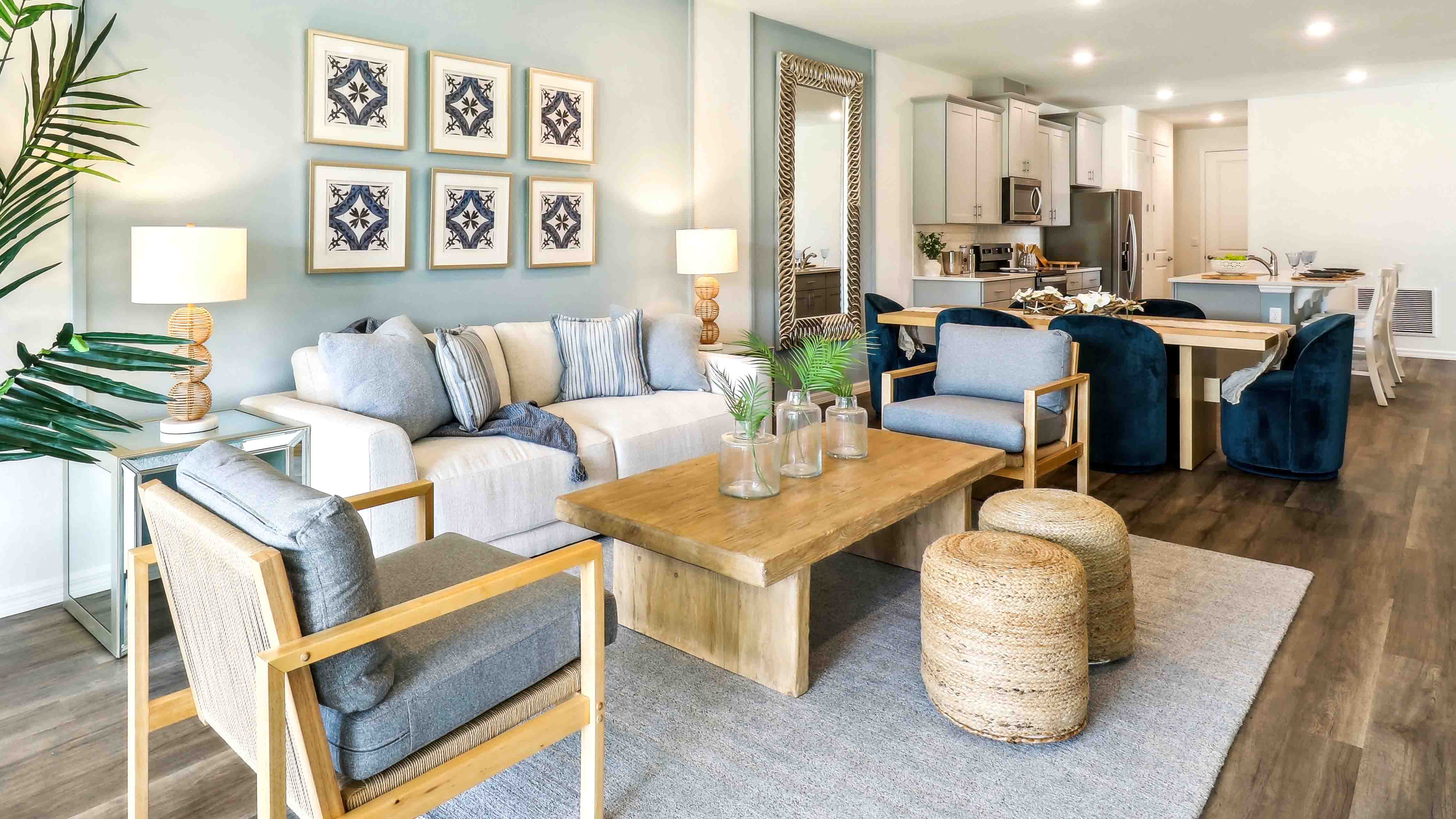 Living area with couch seating, entertainment system and natural lighting