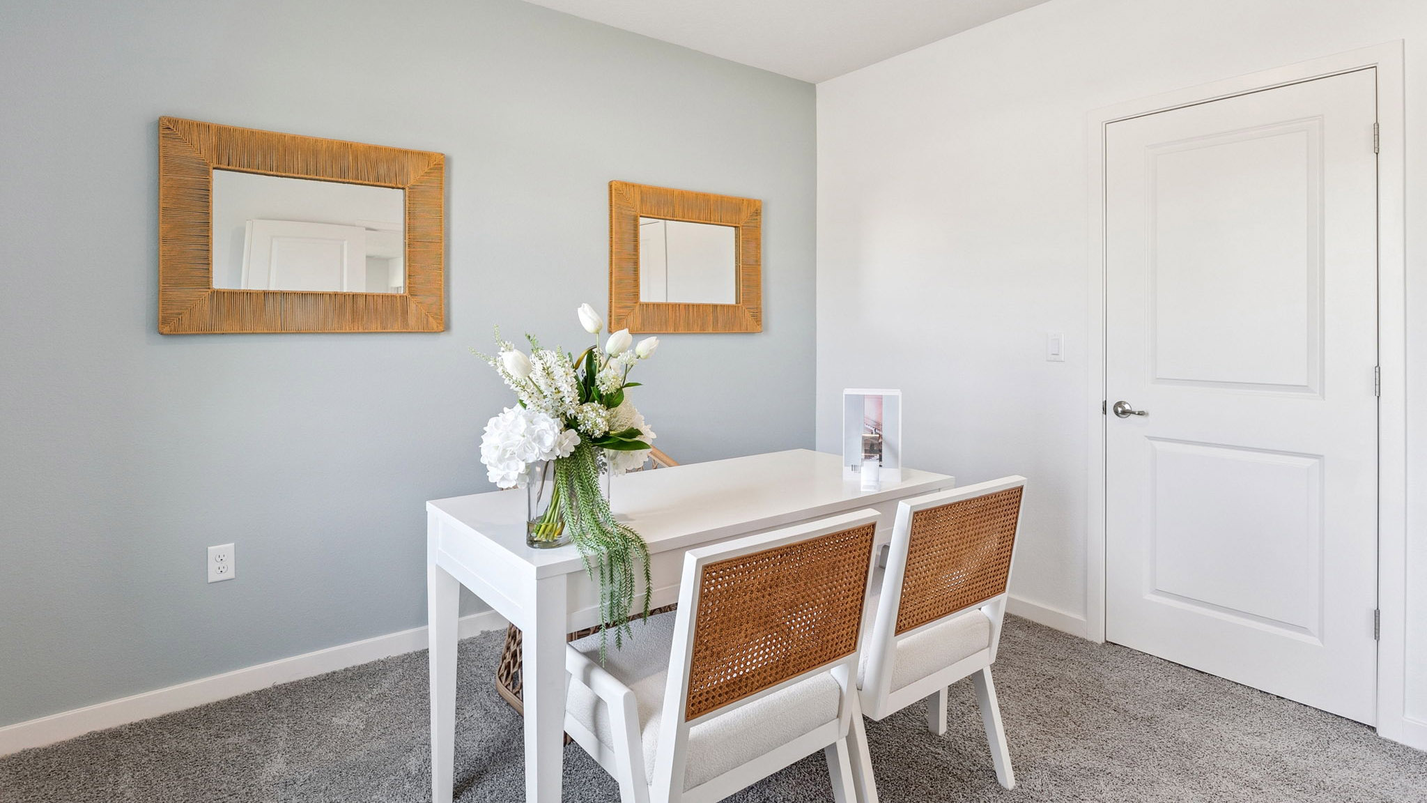 Functional home office with desk, chairs and space to work or play.