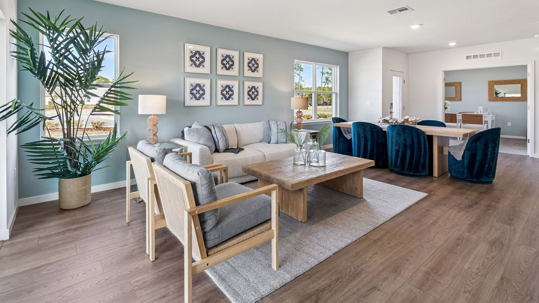 Living area with couch seating, entertainment system and natural lighting