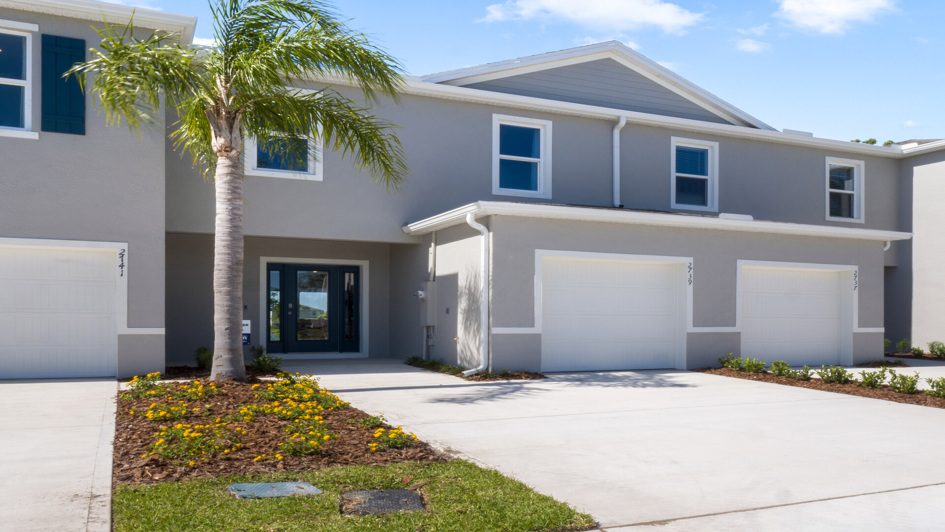 Attached townhome with concrete block construction and a one-car garage.
