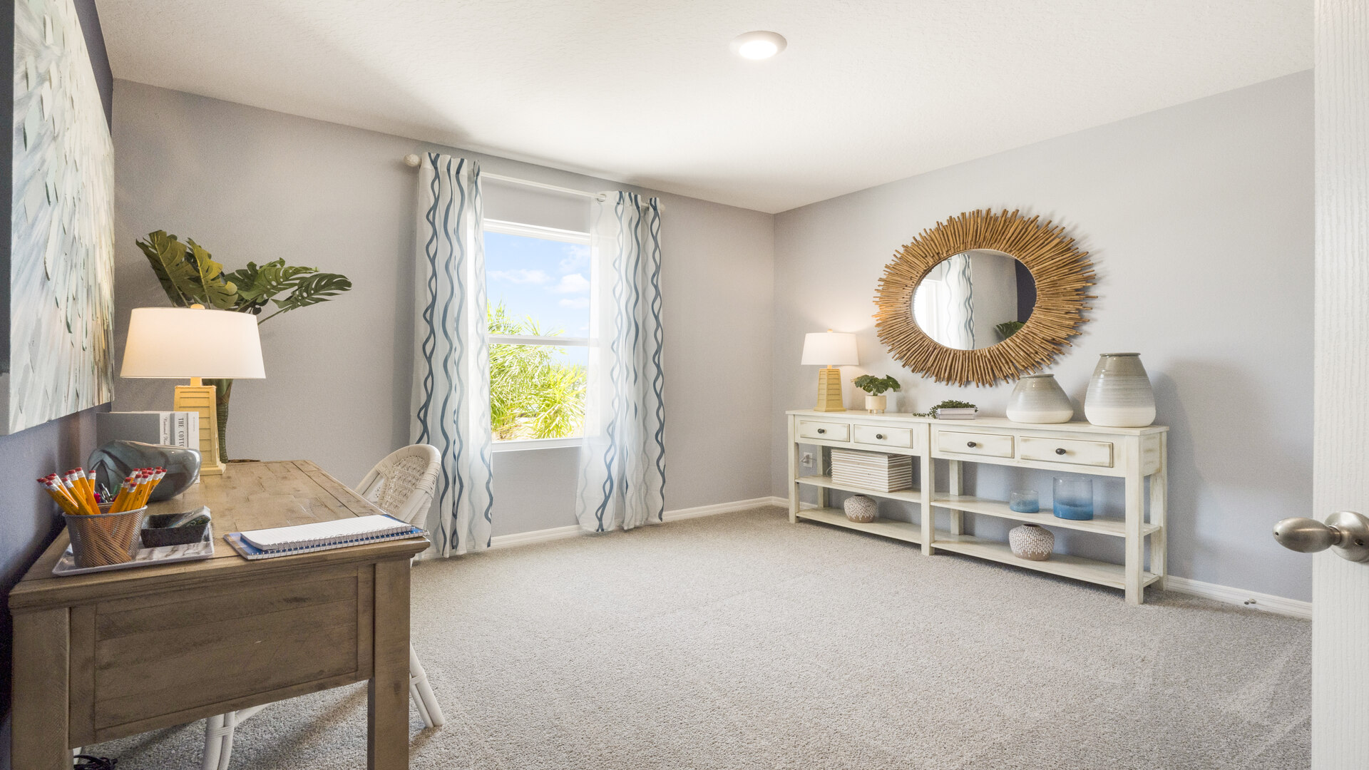 Functional home office with desk, chairs and space to work or play.