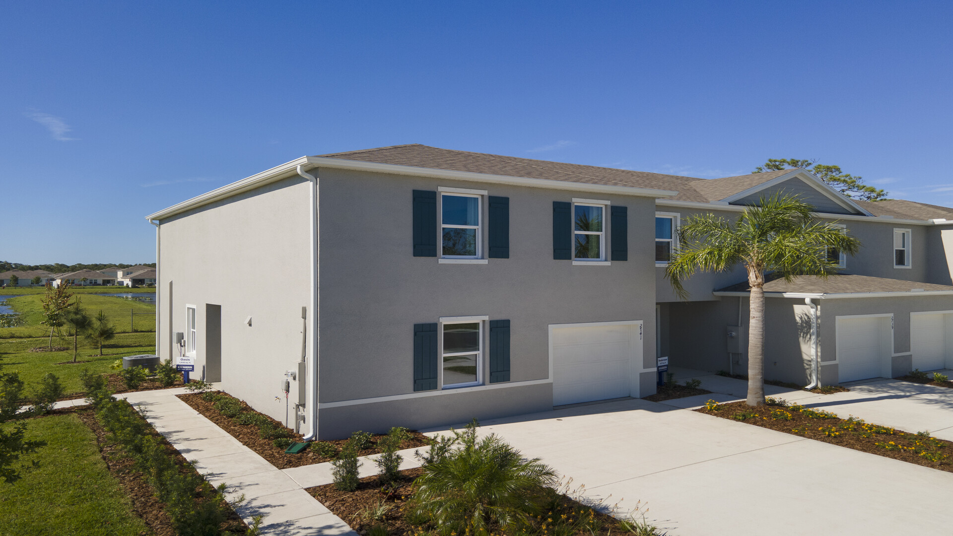 Attached townhome with concrete block construction and a one-car garage.