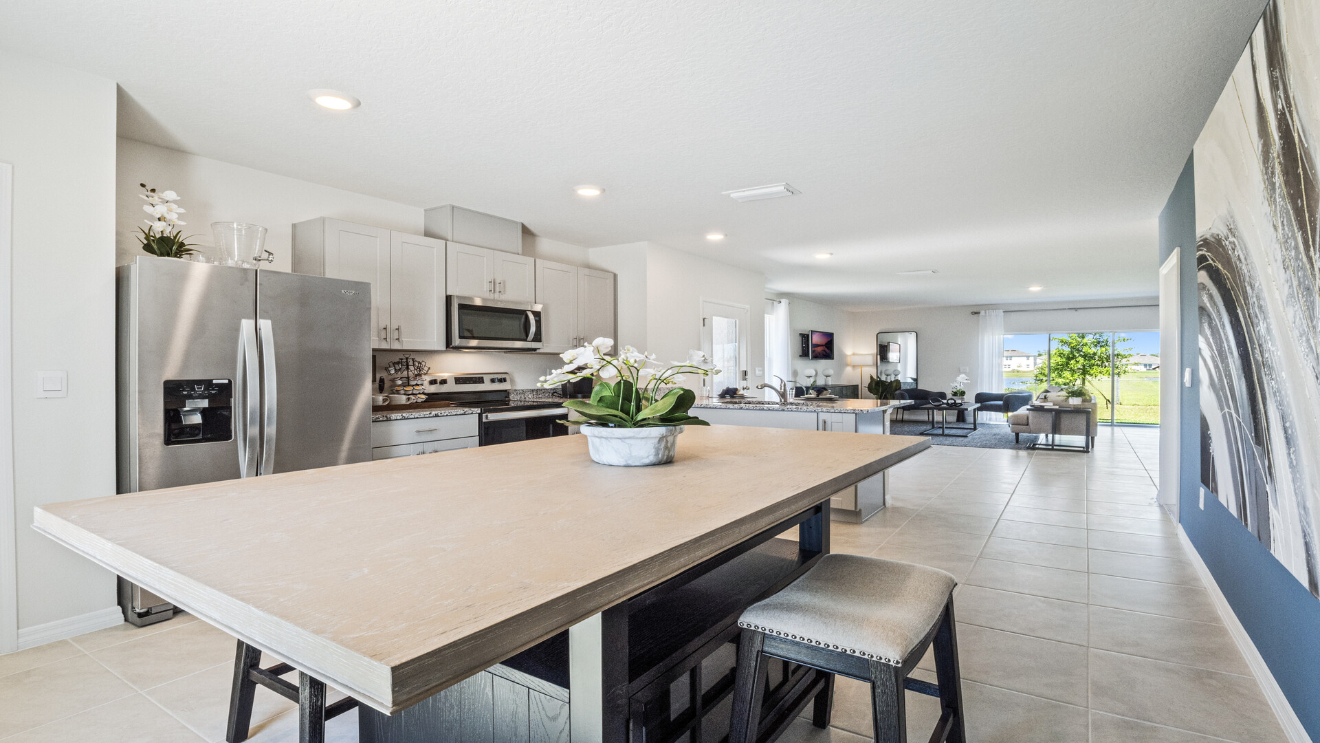 Dining room area with table, seating and natural lighting.