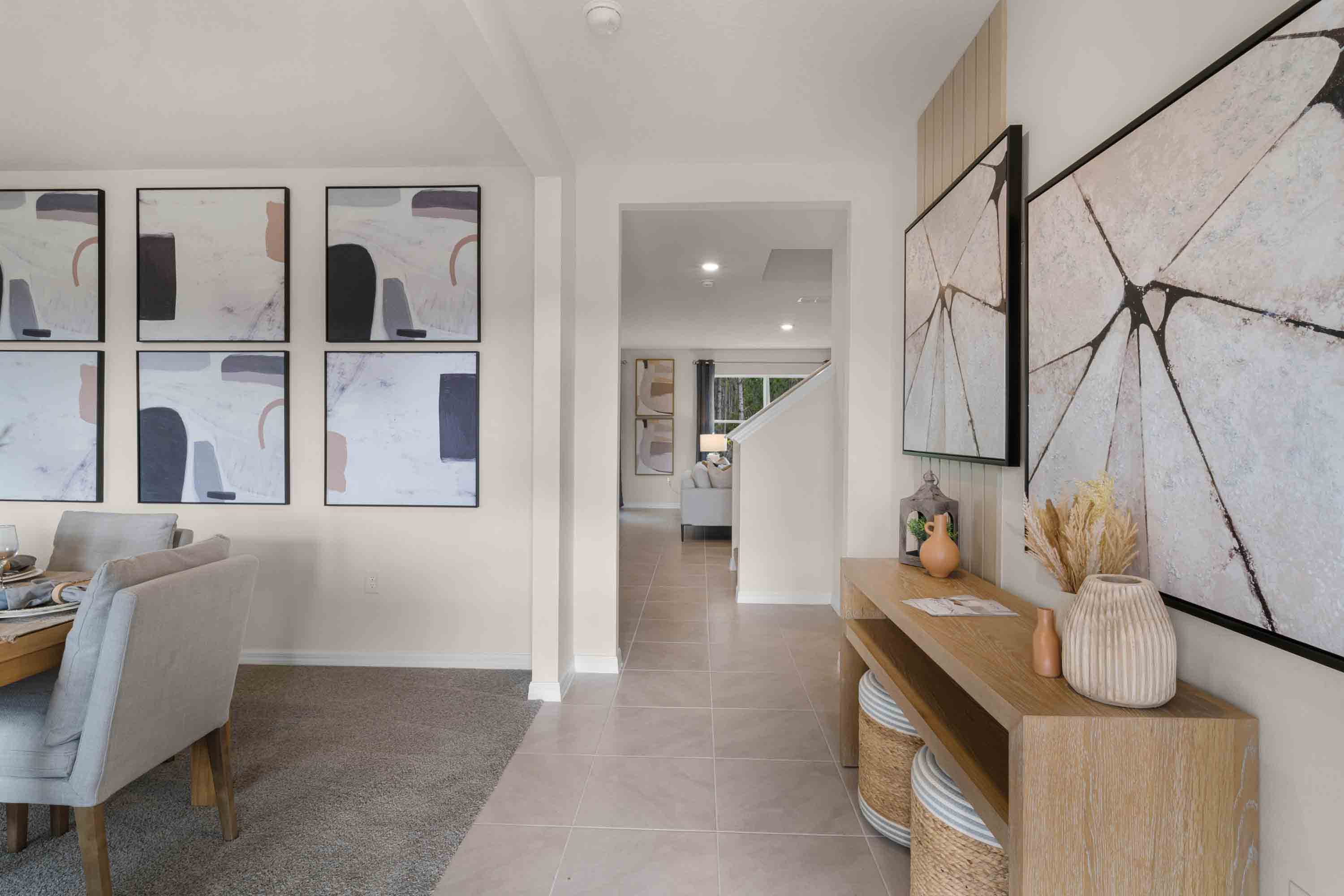 Home entry way thru the front door with tile flooring and a view to the living space.