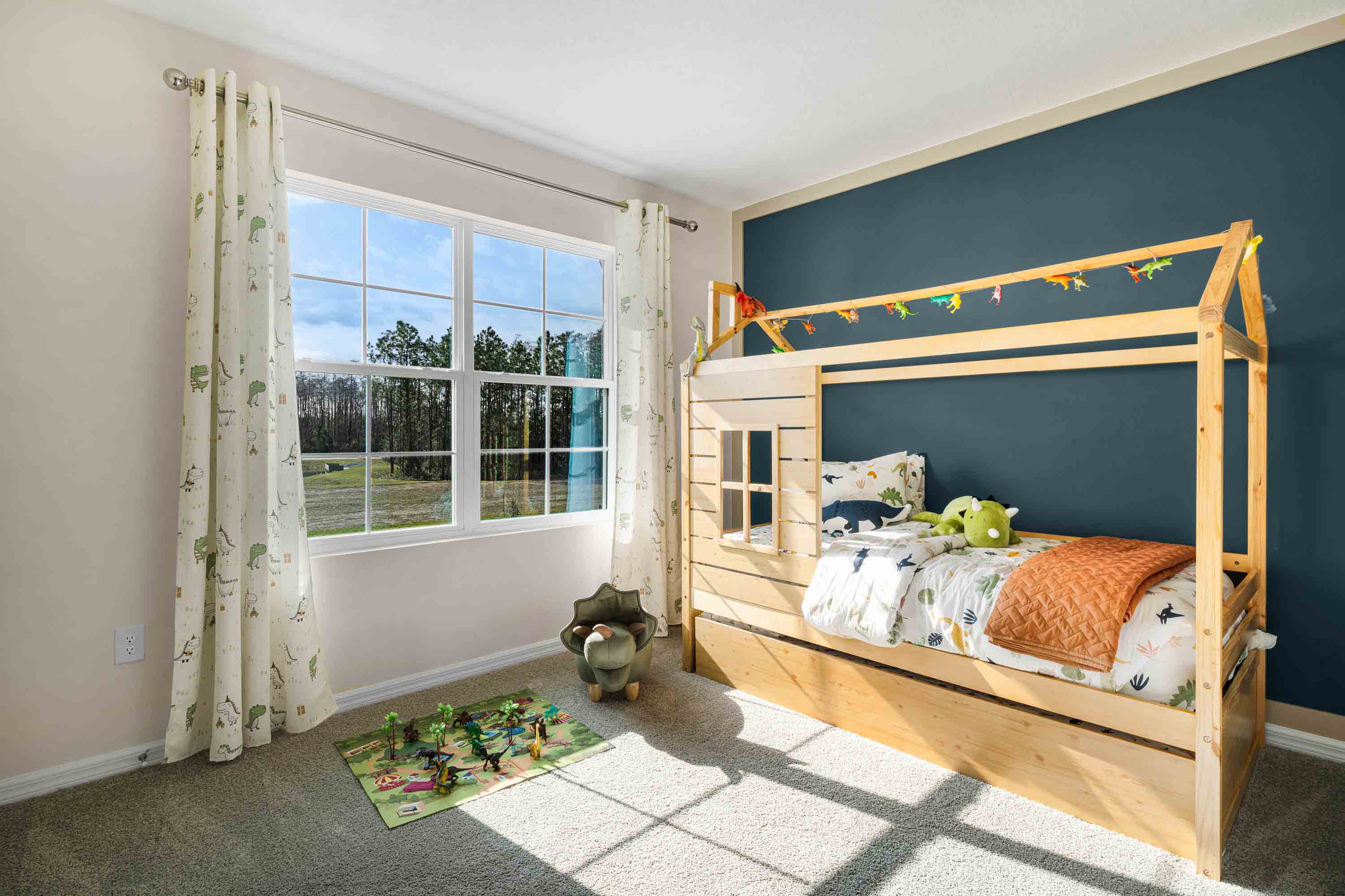 Spare bedroom for guests, with bed, dresser, and ample closet storage.