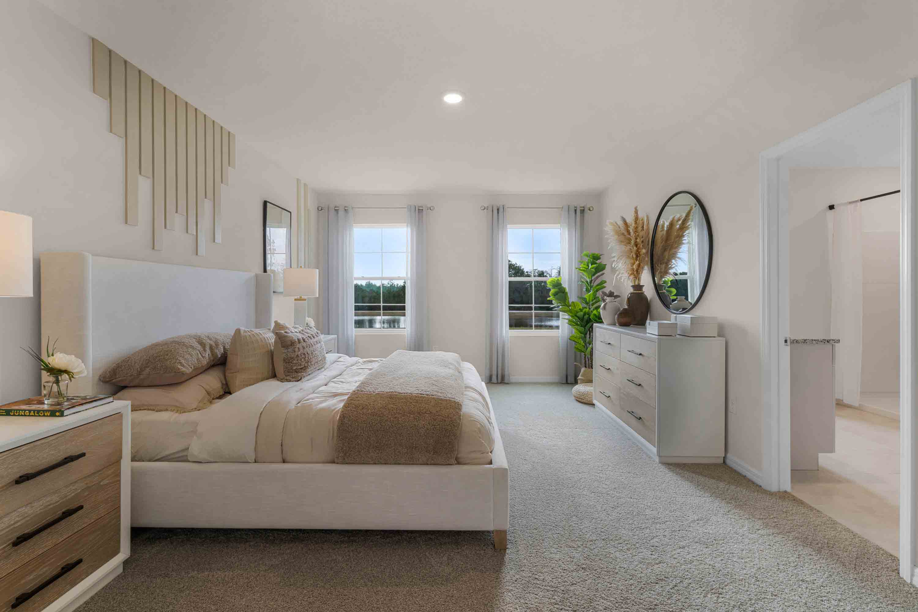 Guest bedroom with bed, nightstands and a roomy closet for storage.
