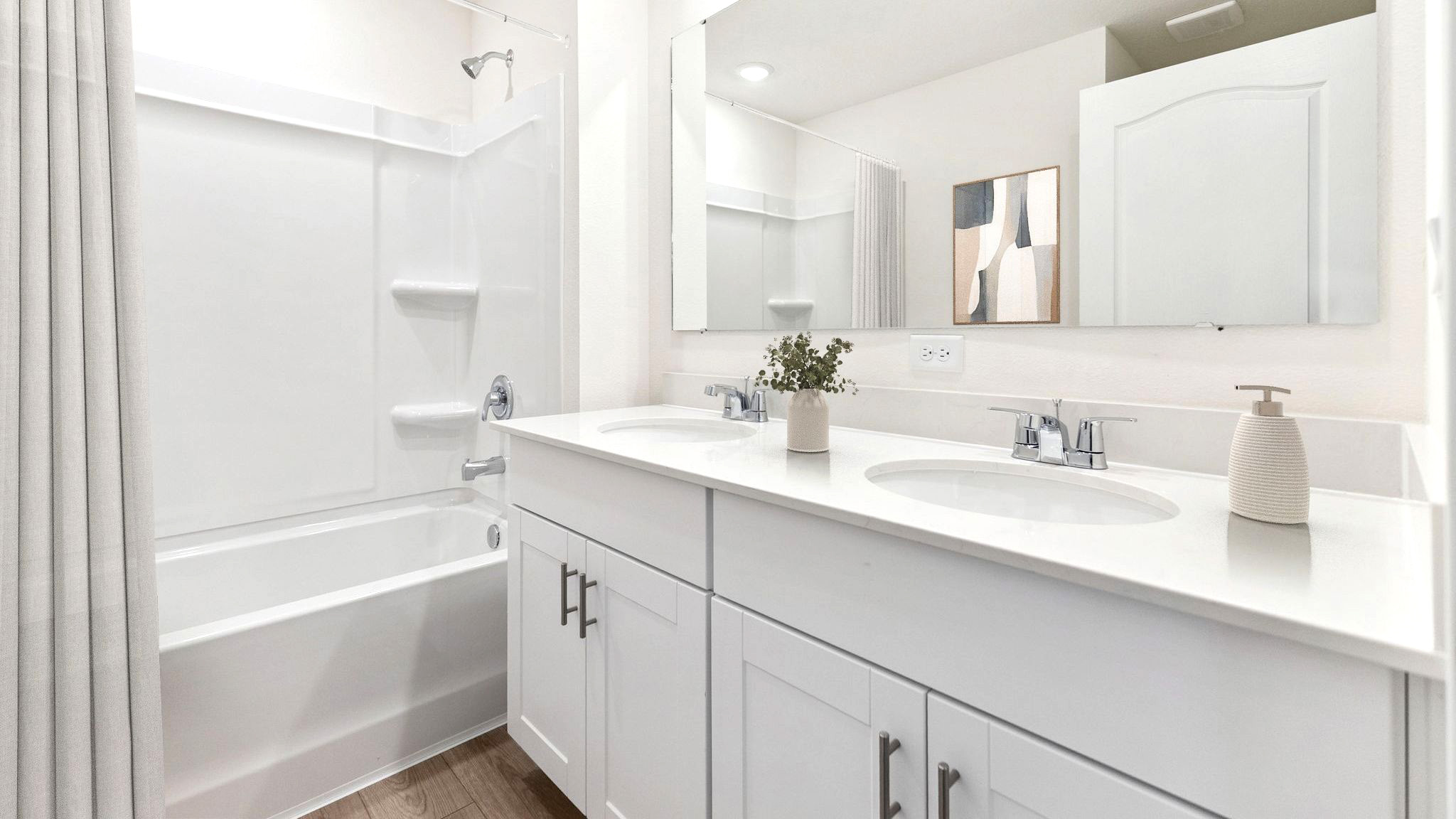 Guest bathroom with single vanity quartz countertops, toilet and shower.