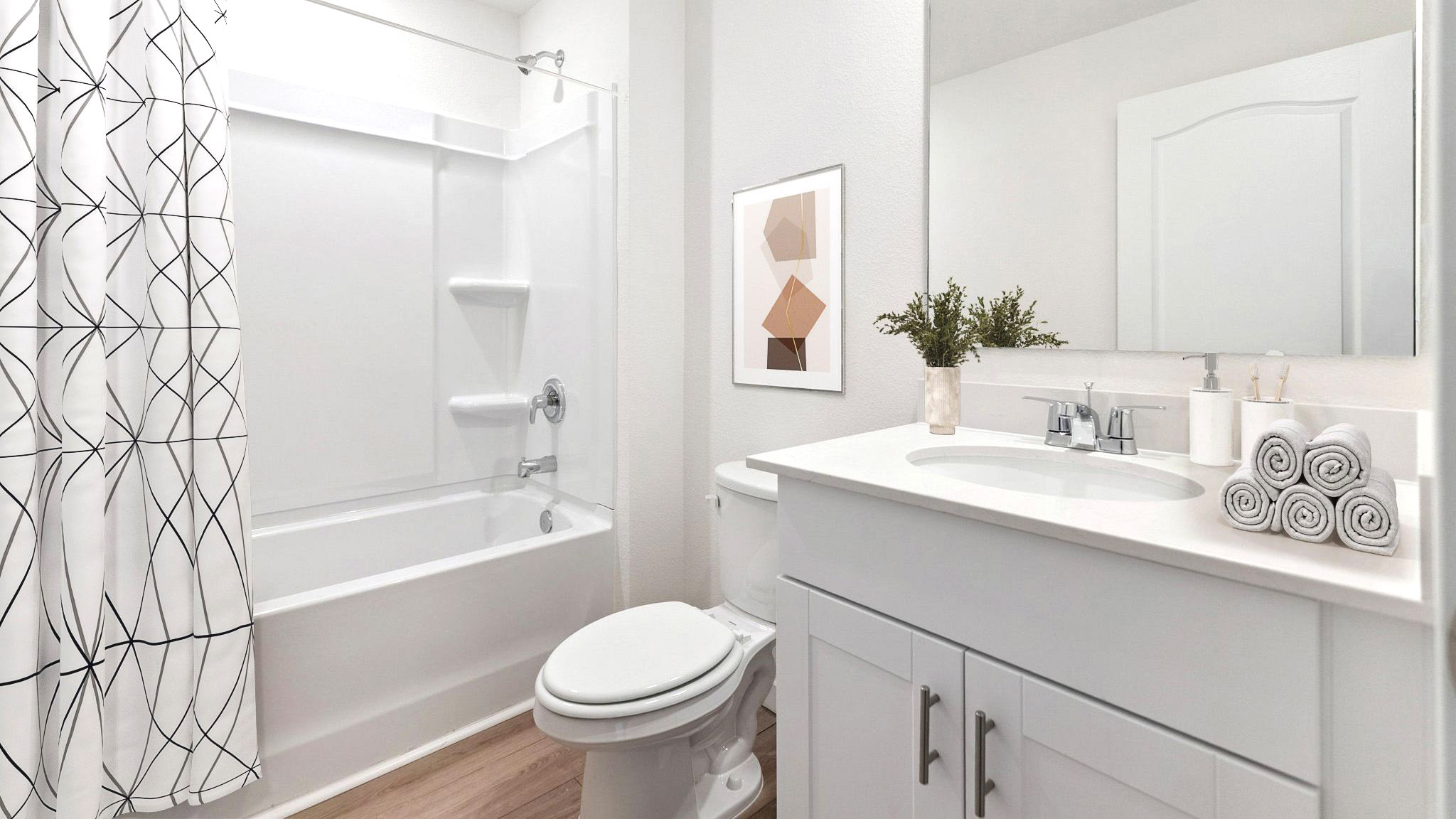 primary bathroom with quartz counters double sink and revwood select flooring