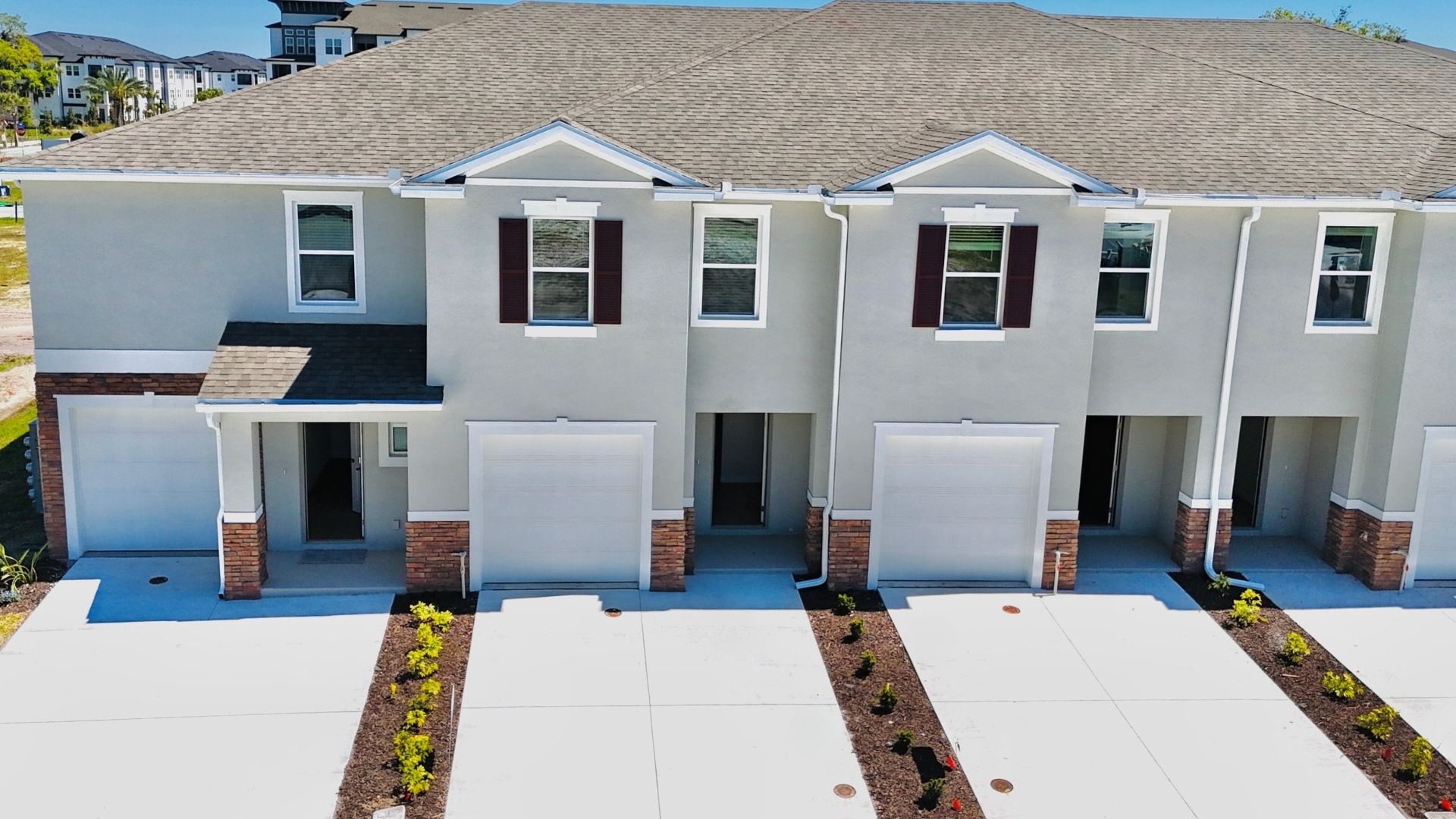 Attached townhome with concrete block construction and a one-car garage.