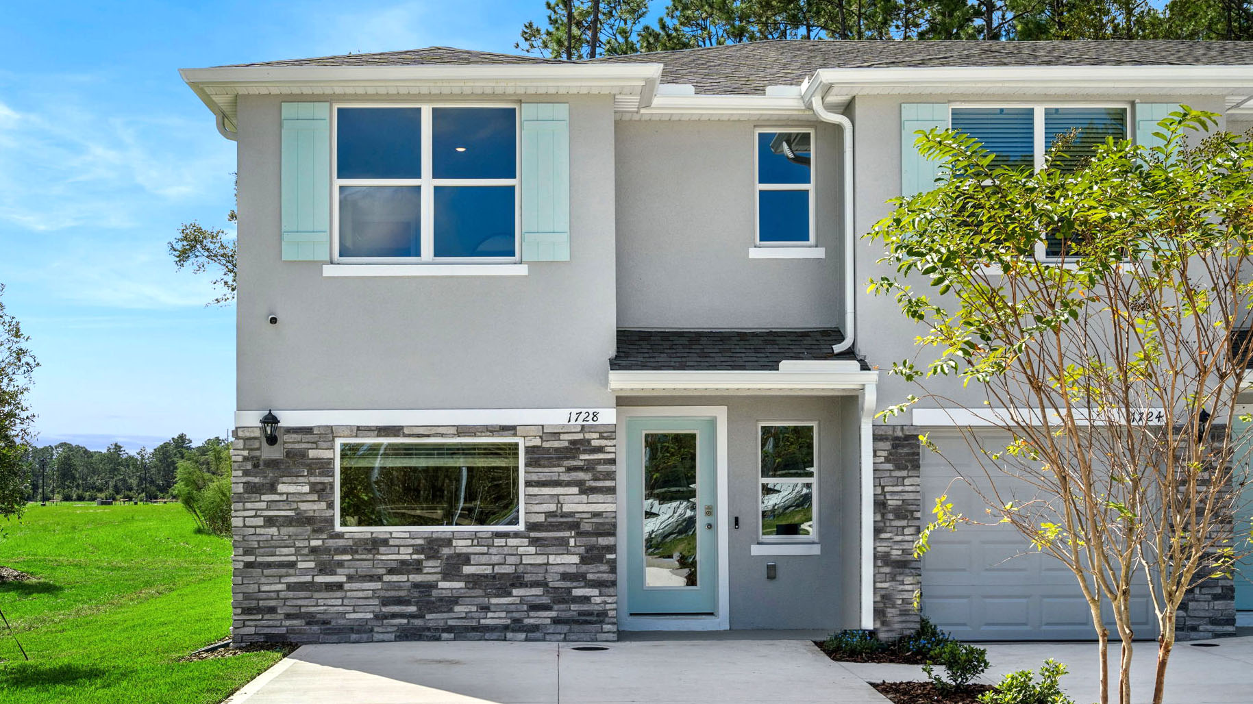 Attached townhome with concrete block construction and a one-car garage.