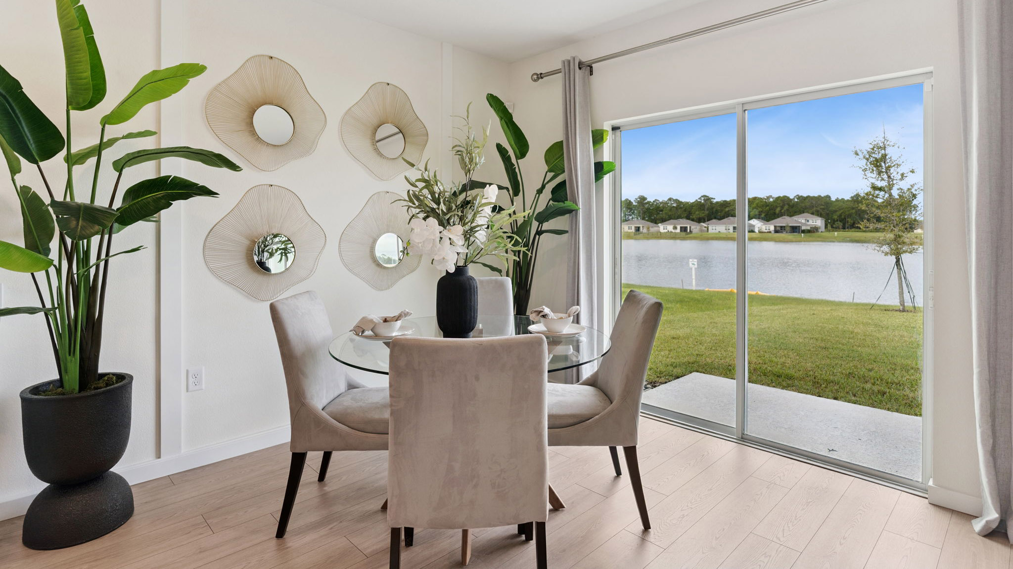Dining room area with table, seating and natural lighting.