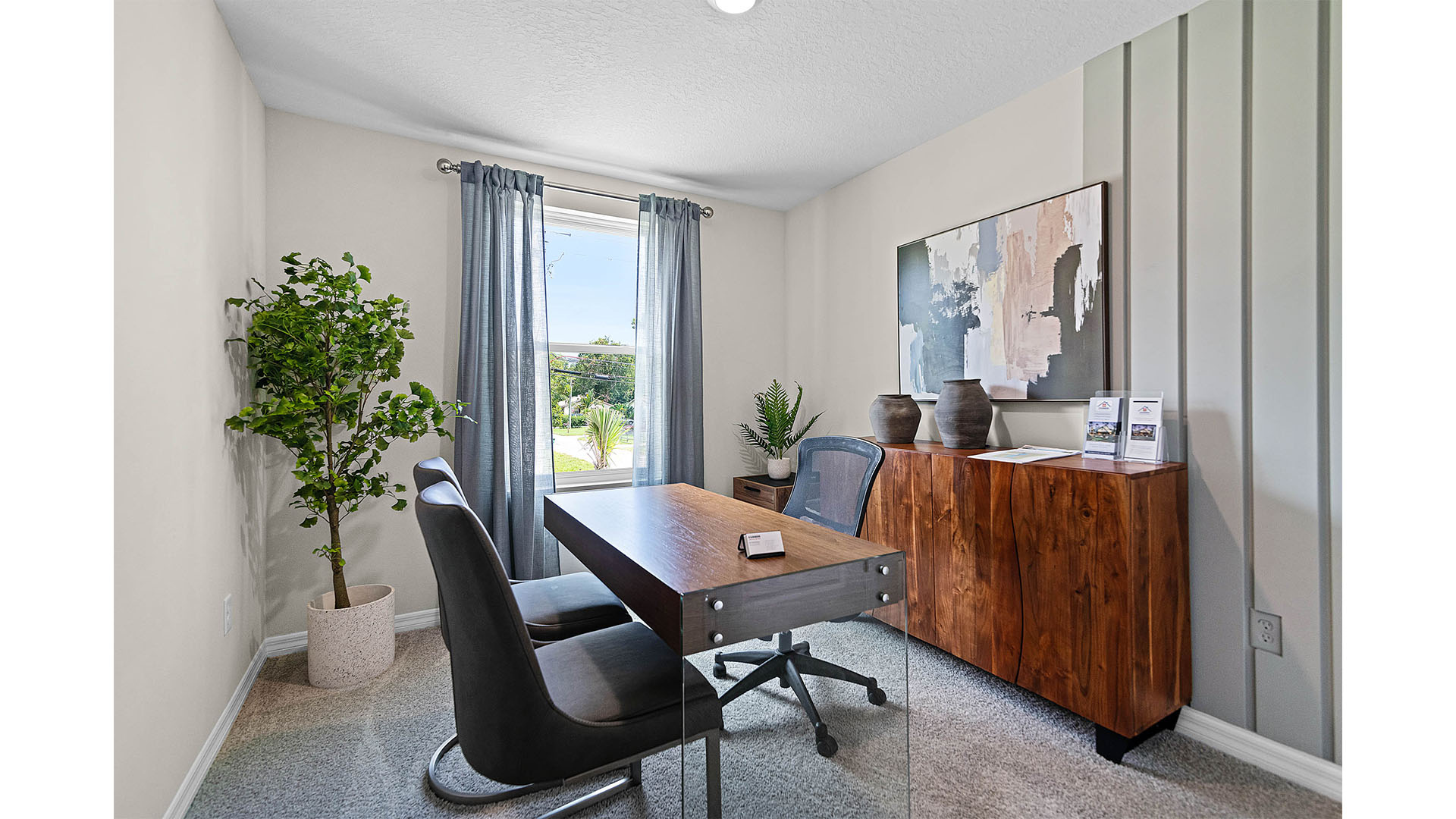 Functional home office with desk, chairs and space to work or play.