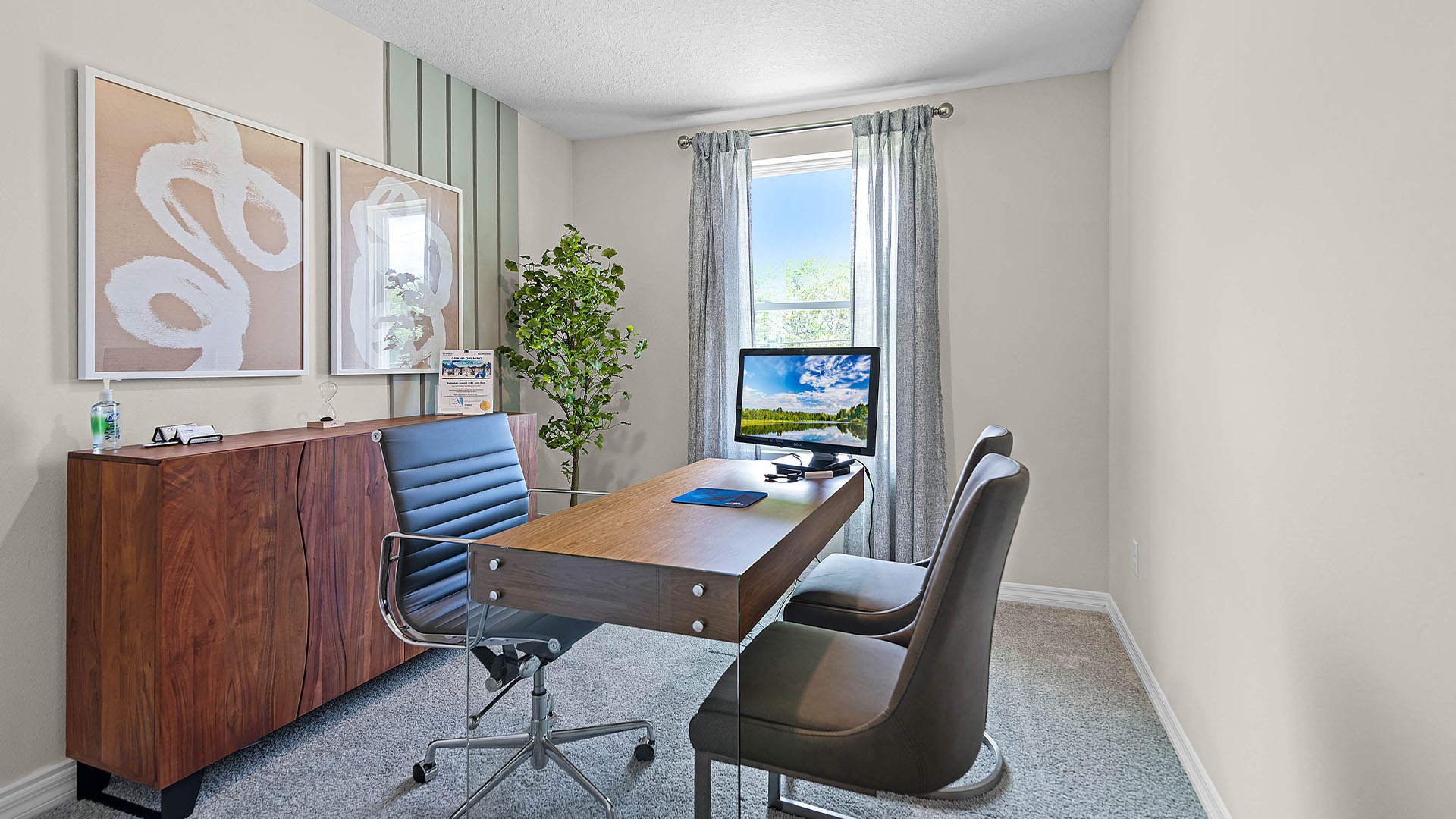 Functional home office with desk, chairs and space to work or play.