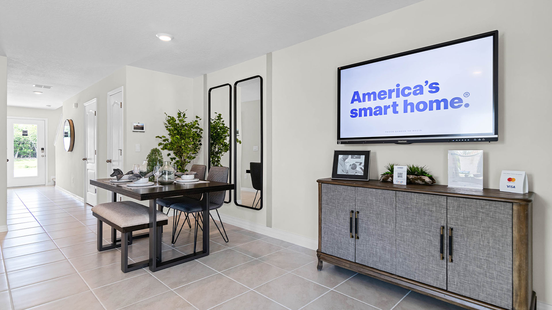 Open concept living area with couch seating and access to the backyard thru slider door.