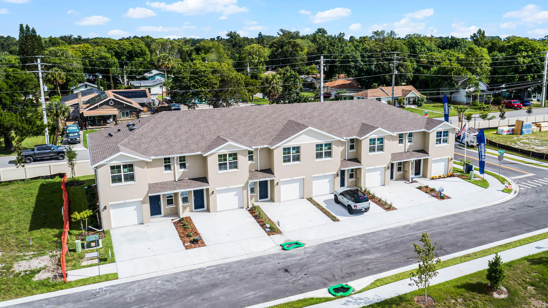 Aerial view of the community amenity area with blue skies and sidewalks