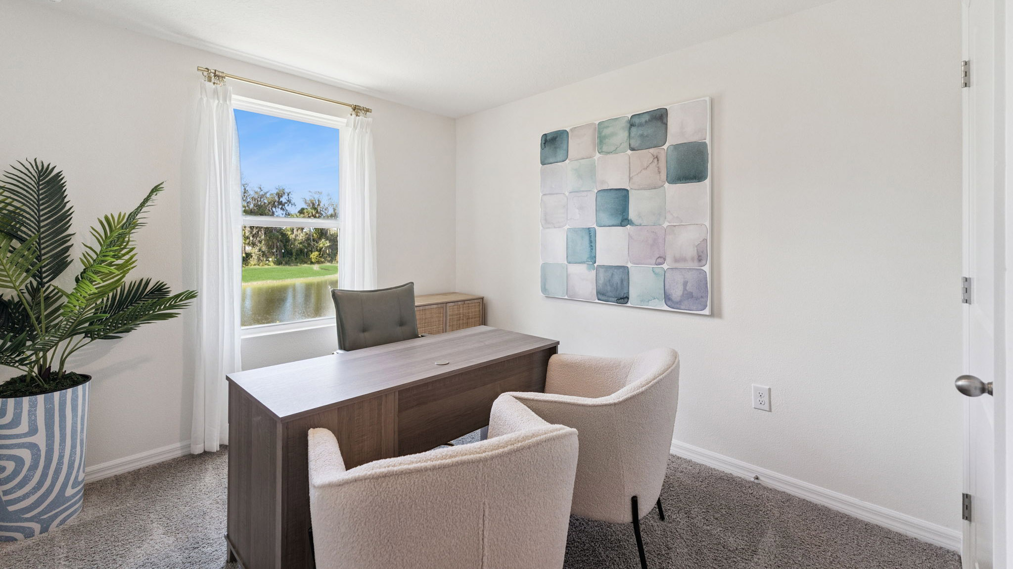 Functional home office with desk, chairs and space to work or play.