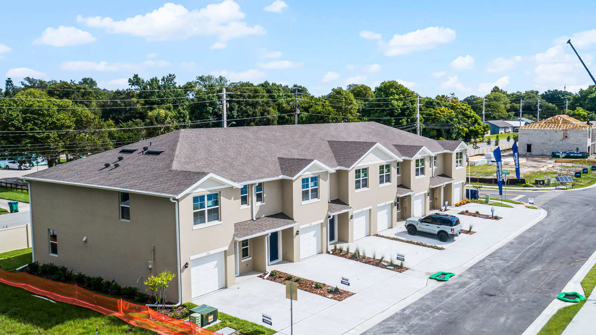 Attached townhome with concrete block construction and a one-car garage.