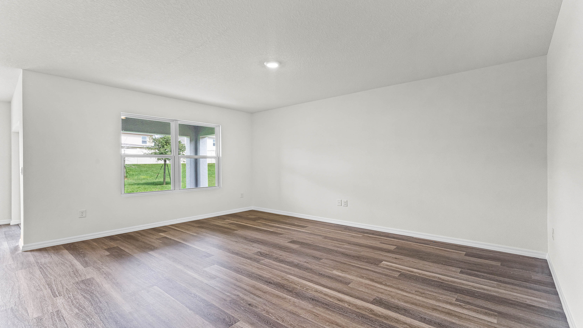 Dining room adjacent to the kitchen with table, chairs and tile flooring.