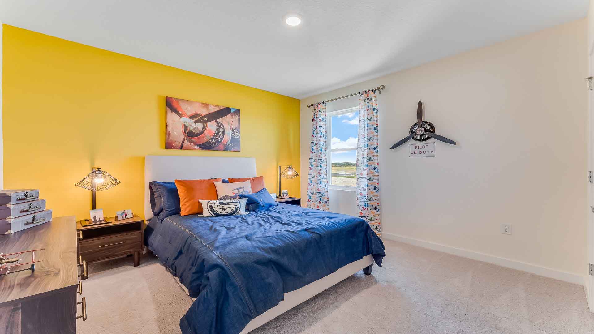 Child's room with toys, bedding, seating and storage and a spacious closet.