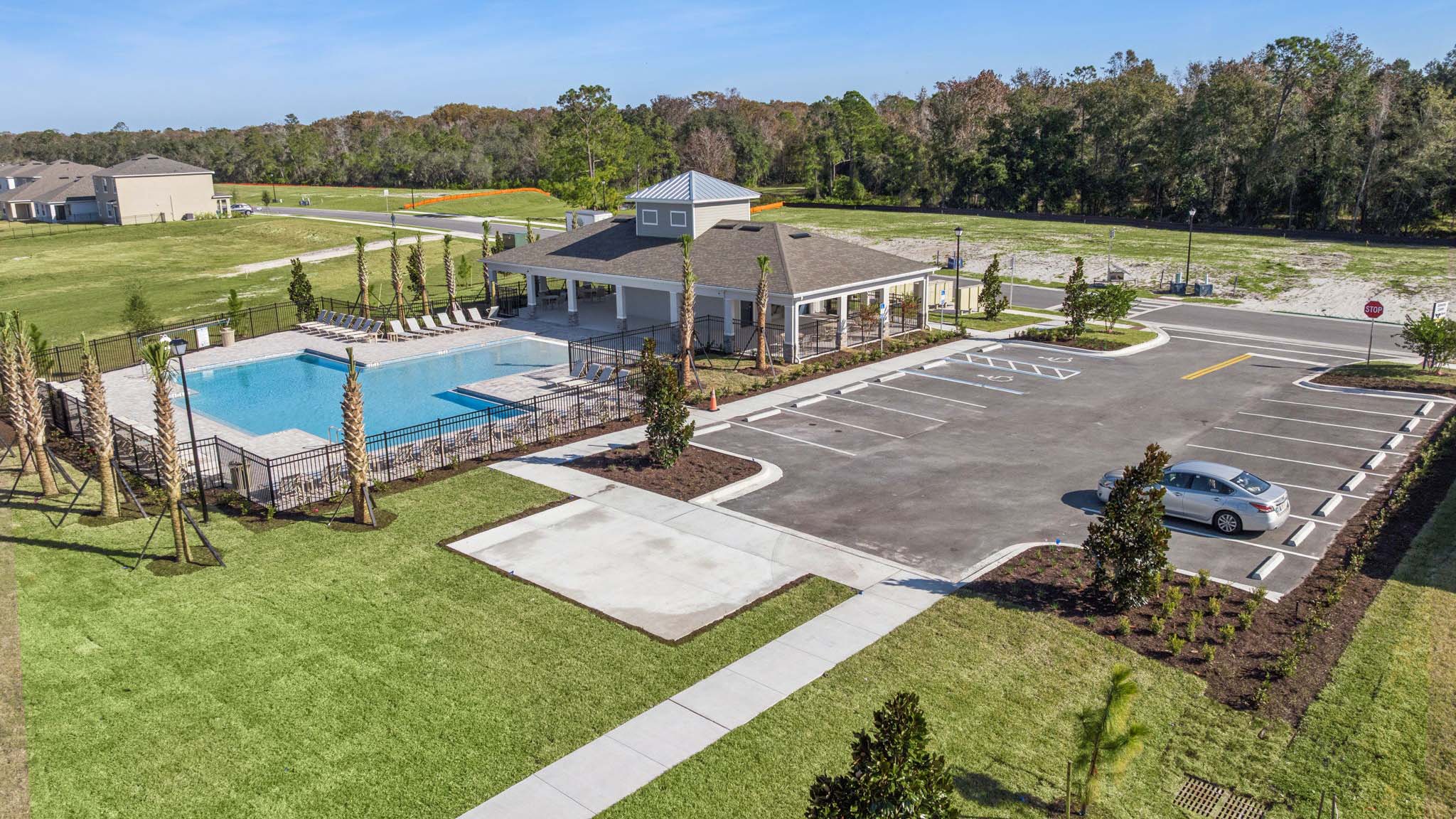 Amenities complex with pool house, pool chairs and pool