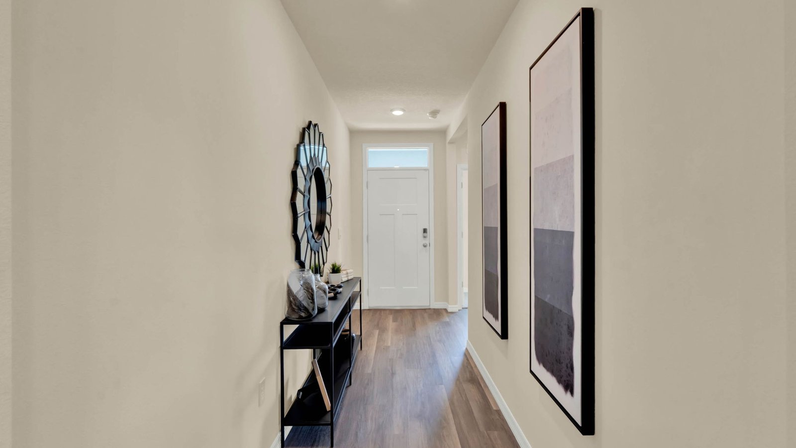 Home entry way thru the front door with tile flooring and front door.