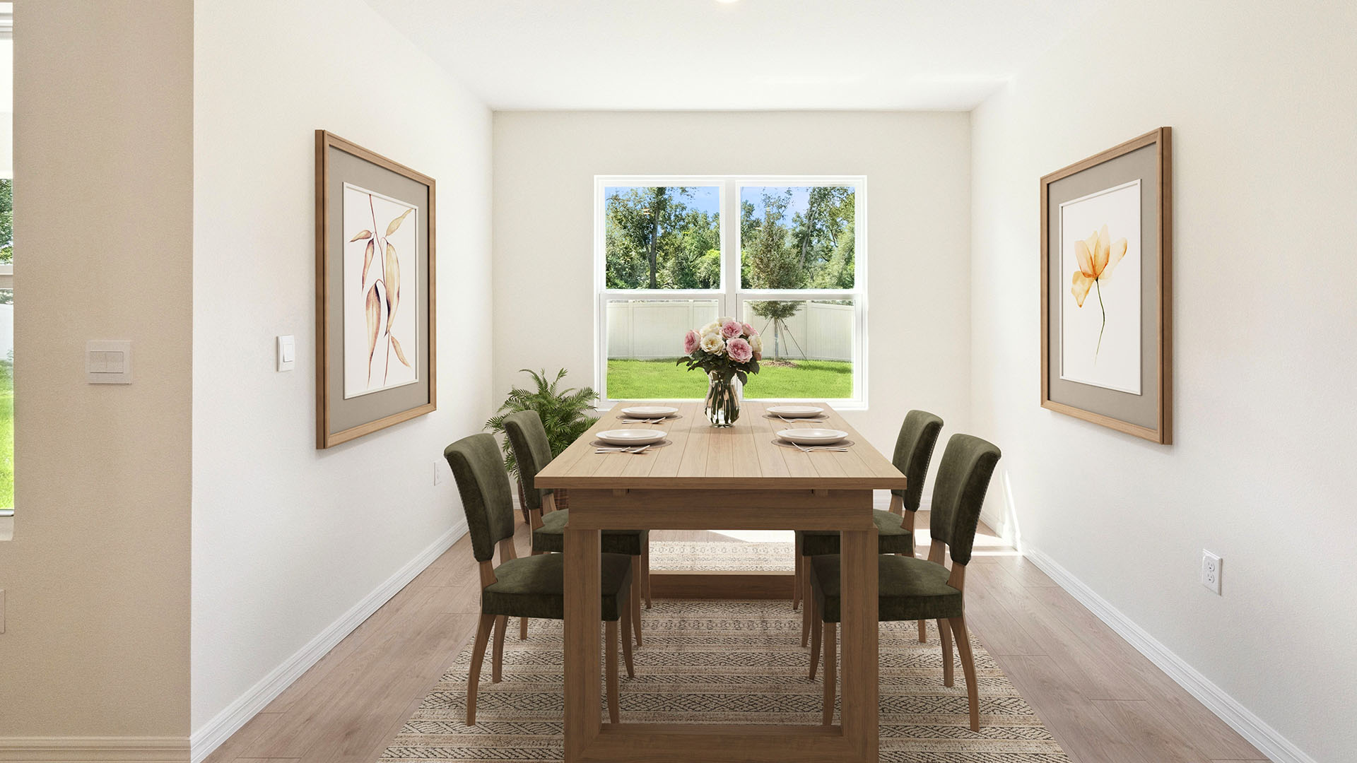 Dining room area with table, seating and natural lighting.