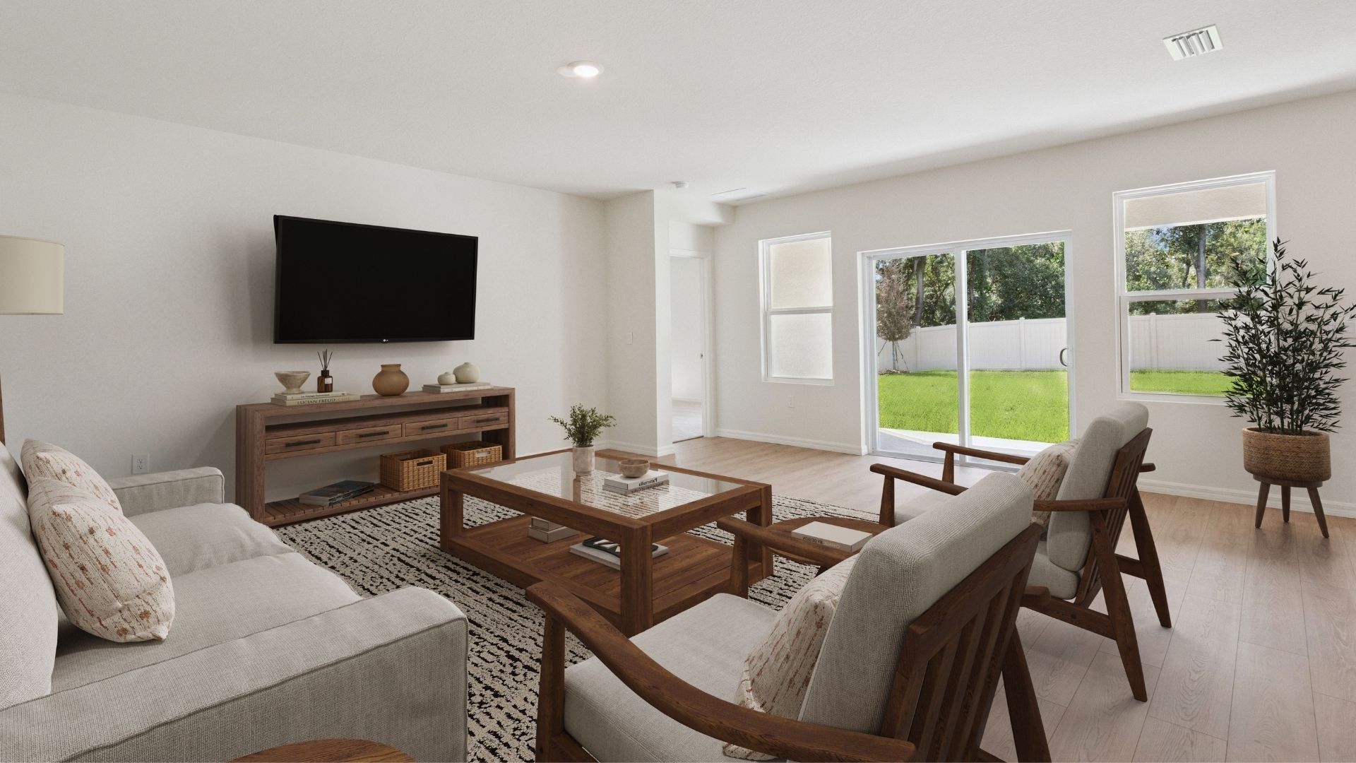 Living area with couch seating, entertainment system and natural lighting