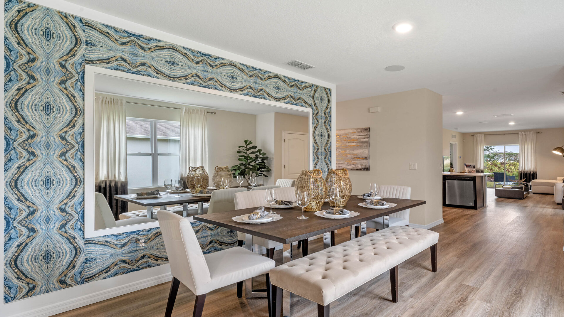 Dining room area with table, seating and natural lighting.